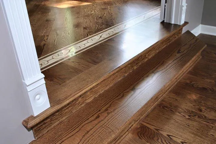 Custom hardwood staircase nosing and inlay detail by 1 Wood Floors Technical Specification Concierge